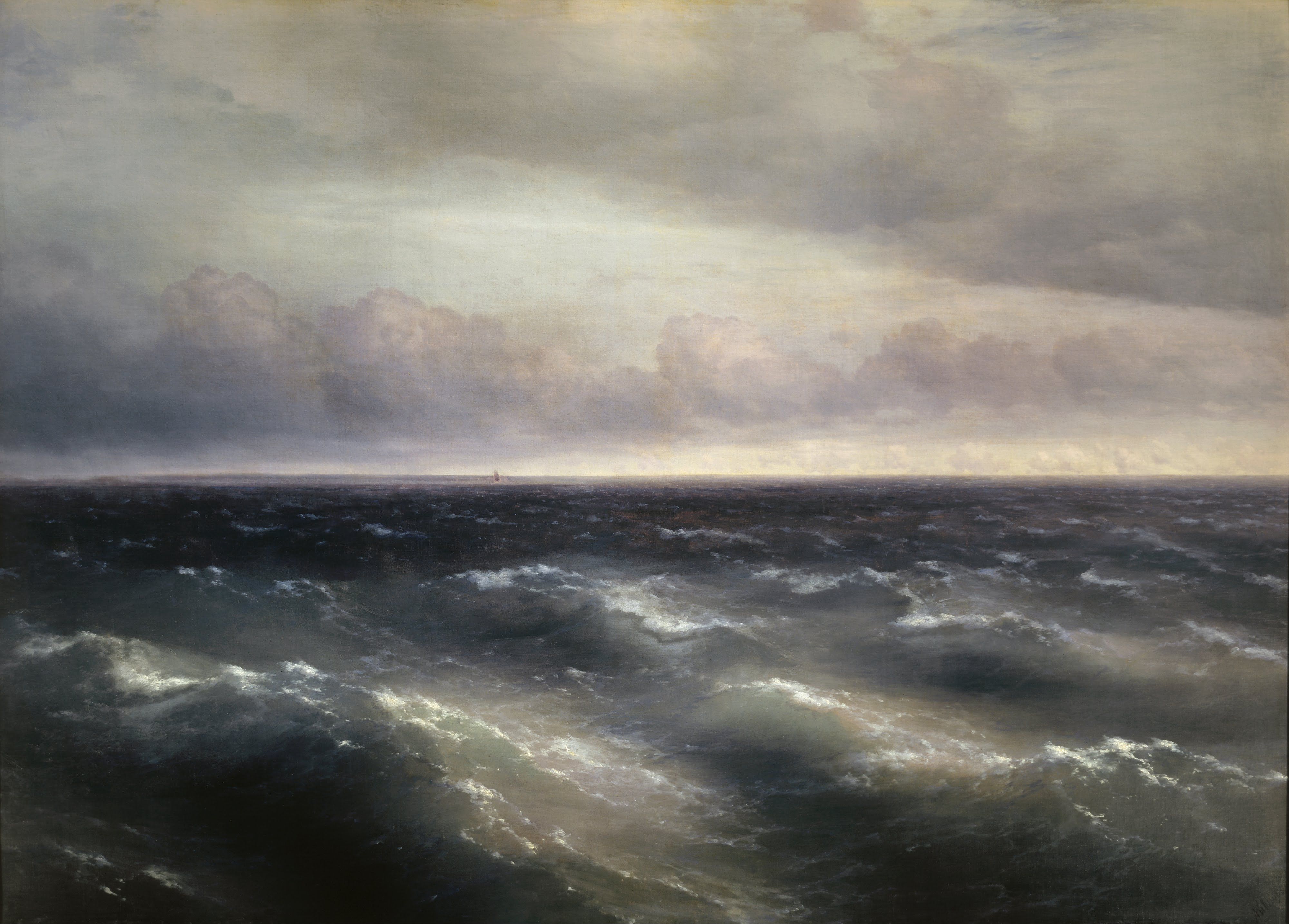 A low horizon over ranks of dark grey-blue swells building into a storm, one small sail far off
