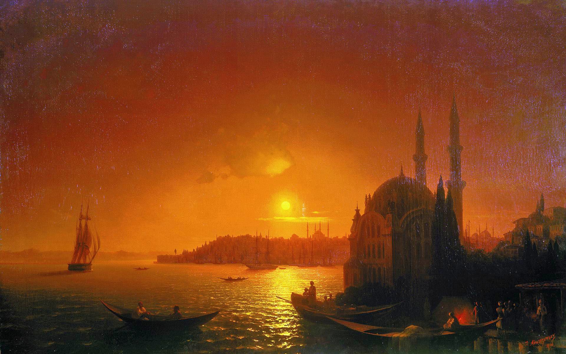The harbour after dark, a red sky behind the minarets and a fire burning on the quay