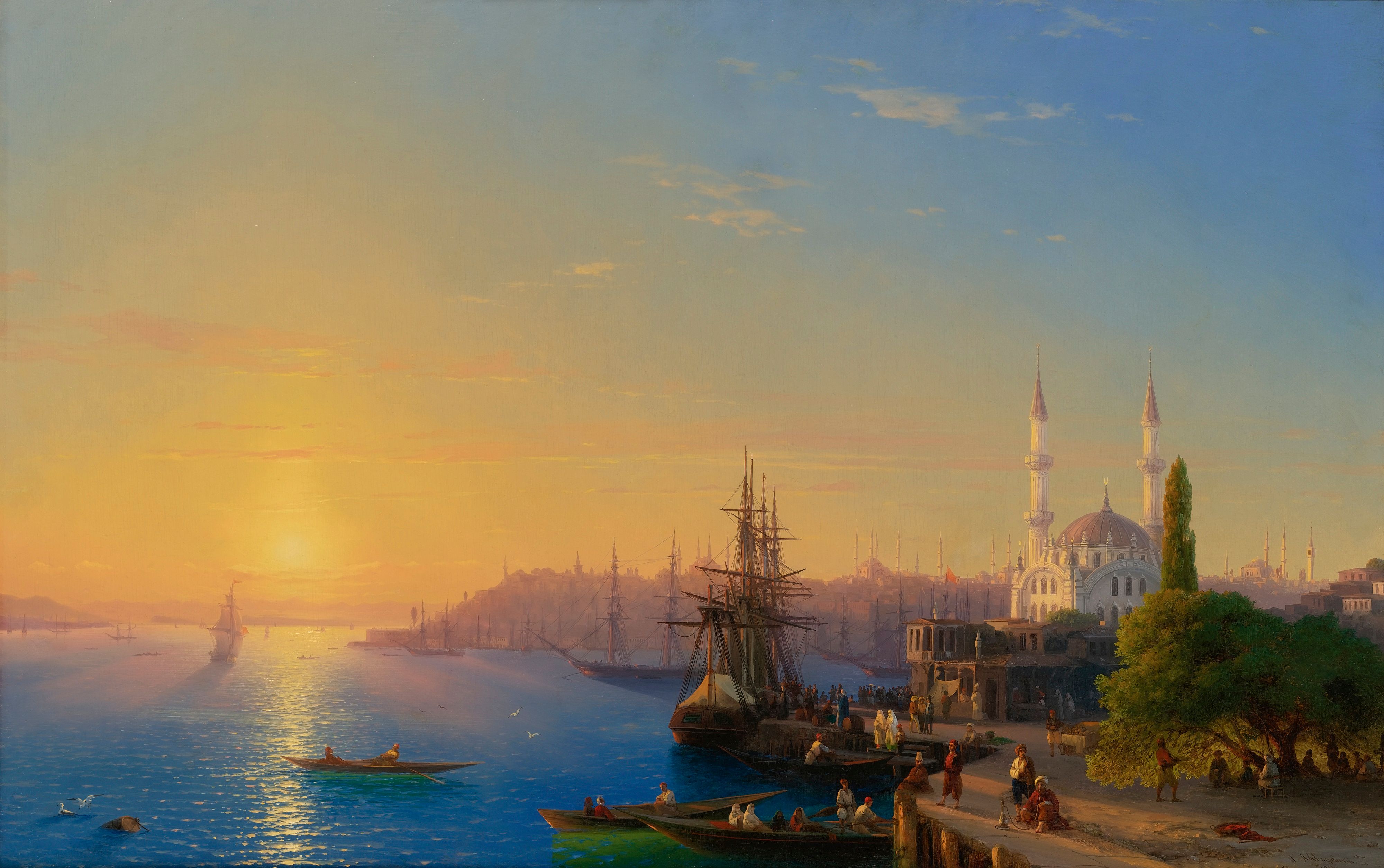 The Bosphorus at sunset, a domed mosque and minarets on the right bank and caiques drawn up along the shore