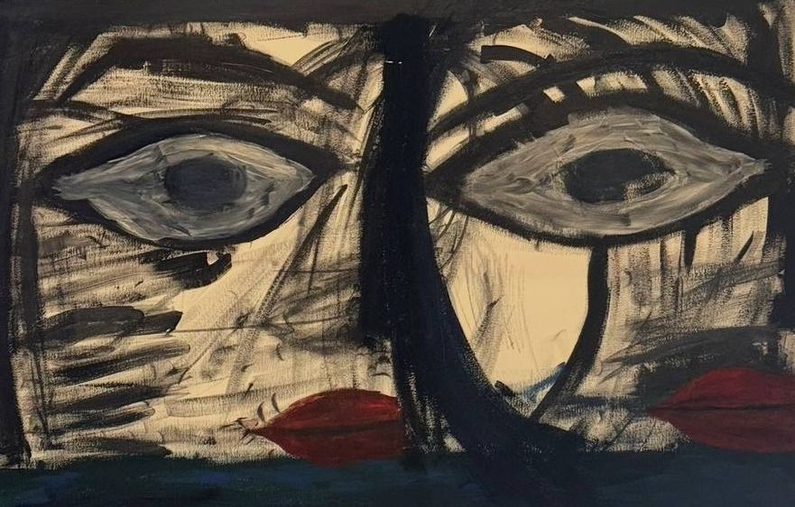Bold black-and-cream painted face with two large eyes and a red mouth