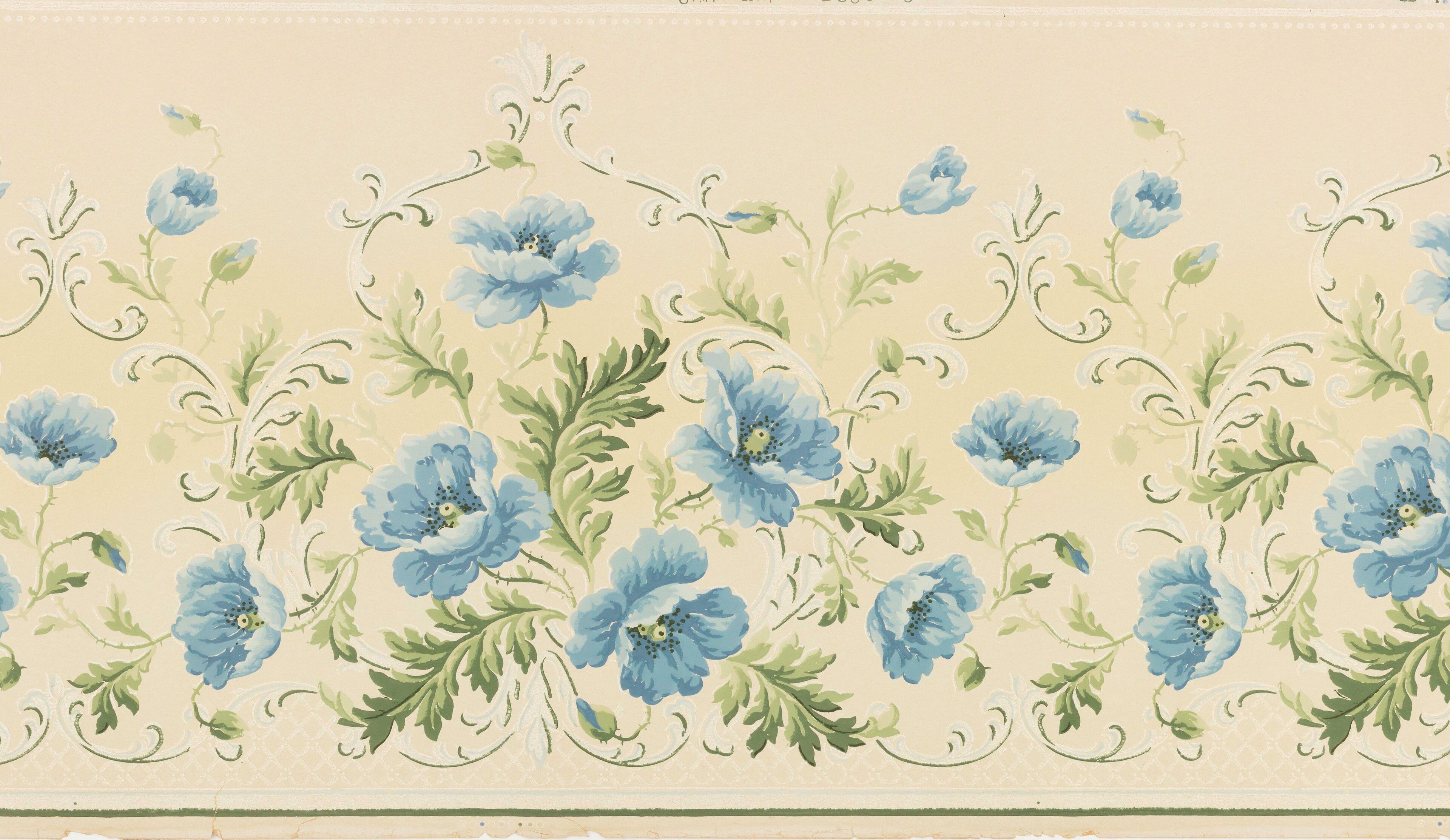 Blue poppies on green scrolling stems along a cream band, with a strip of pale lattice running under them