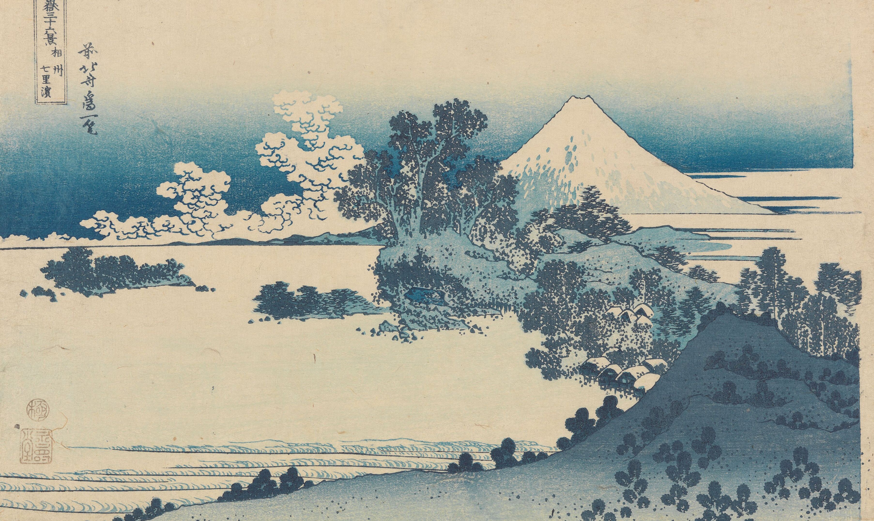 A pale shoreline curving away under Mount Fuji, pine scrub in the foreground and a flat blue sea beyond