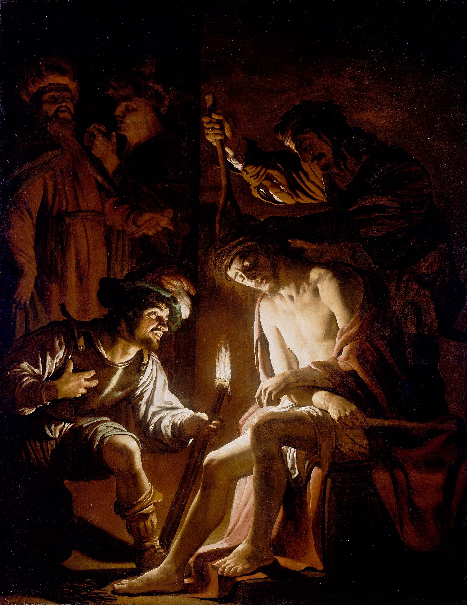 A night scene lit by one torch held low, a kneeling soldier pressing a crown of thorns onto a bound seated figure