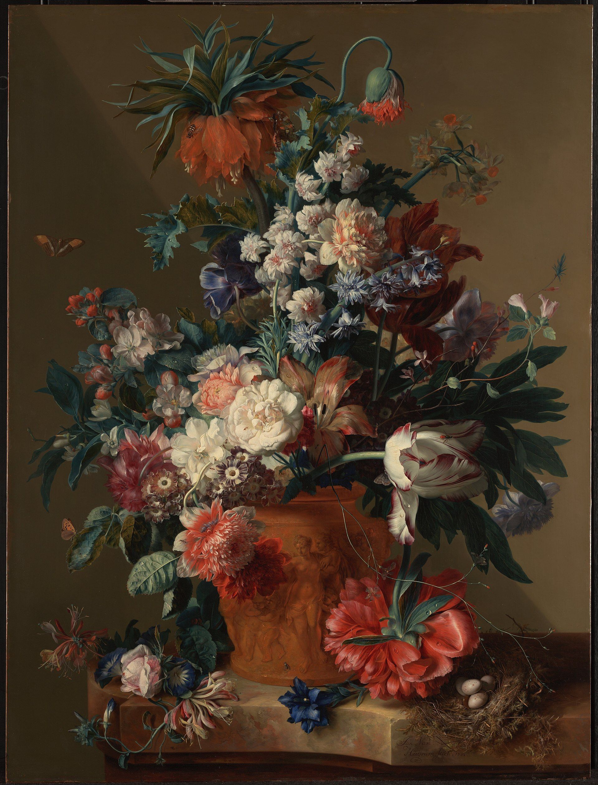 A tall bouquet of poppies, roses and a crown imperial spilling from a terracotta urn, a nest of eggs on the ledge below