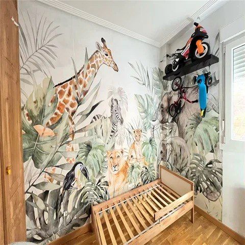 Child's bedroom painted around two corners with a watercolour jungle of giraffe, zebra, lion cubs, a toucan and palm leaves