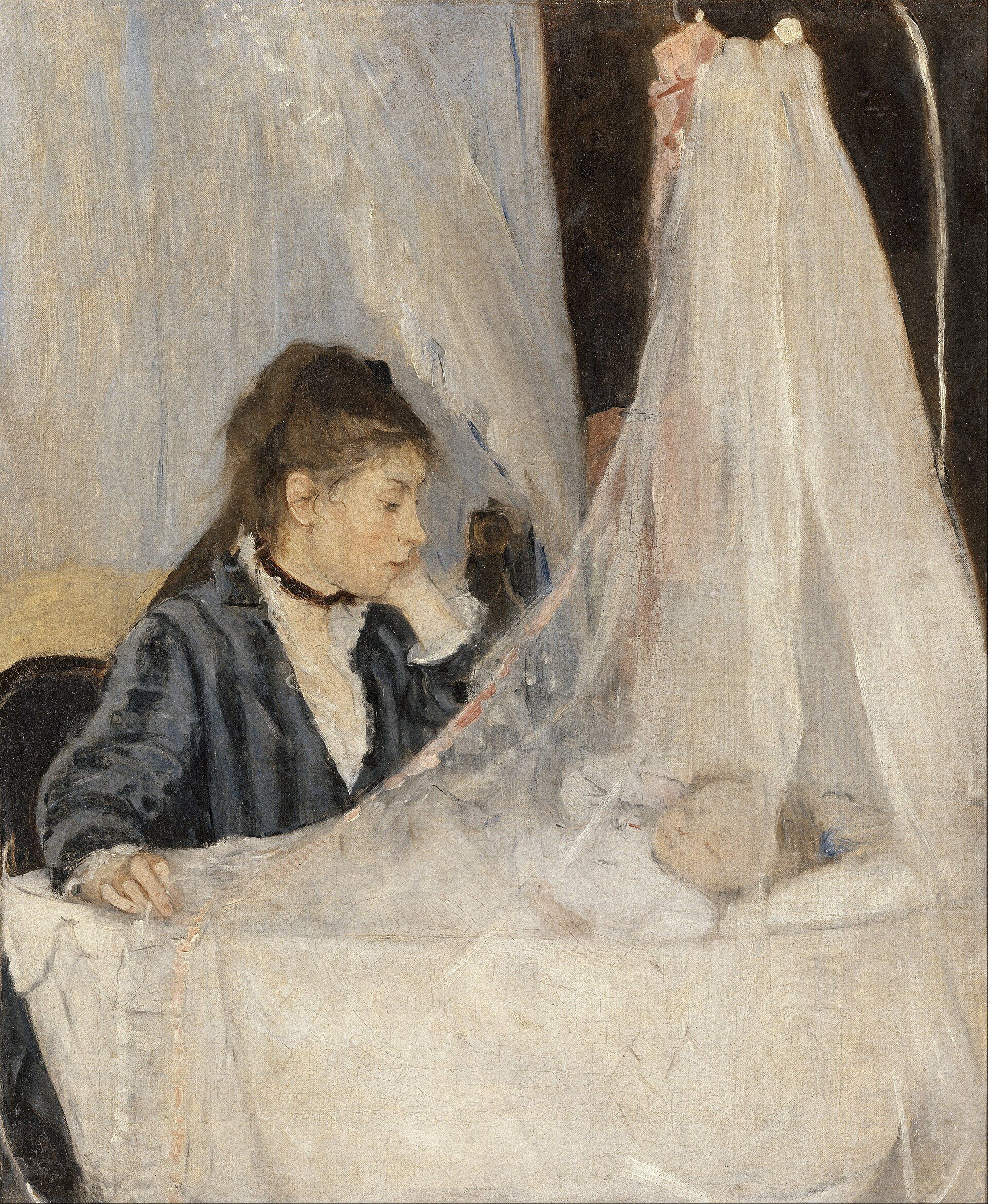 A woman in dark clothes resting her chin on her hand and watching a sleeping baby through the white gauze draped over its cradle