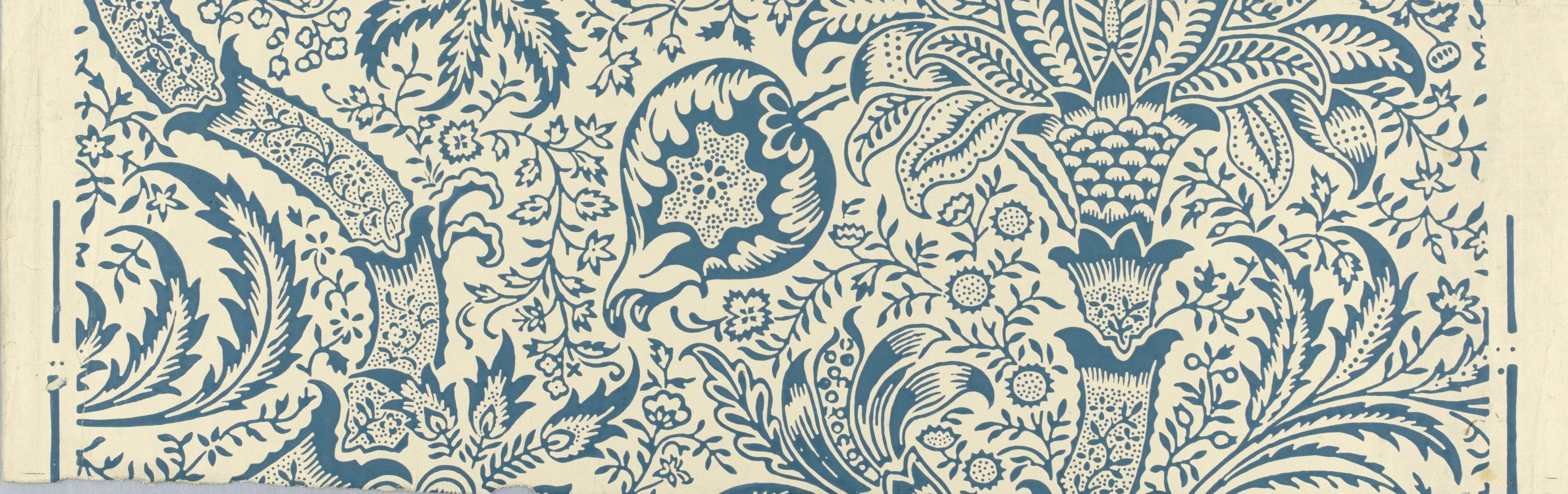 Cream ground crossed by a broad blue band of scrolling acanthus, palmettes and a flowering urn