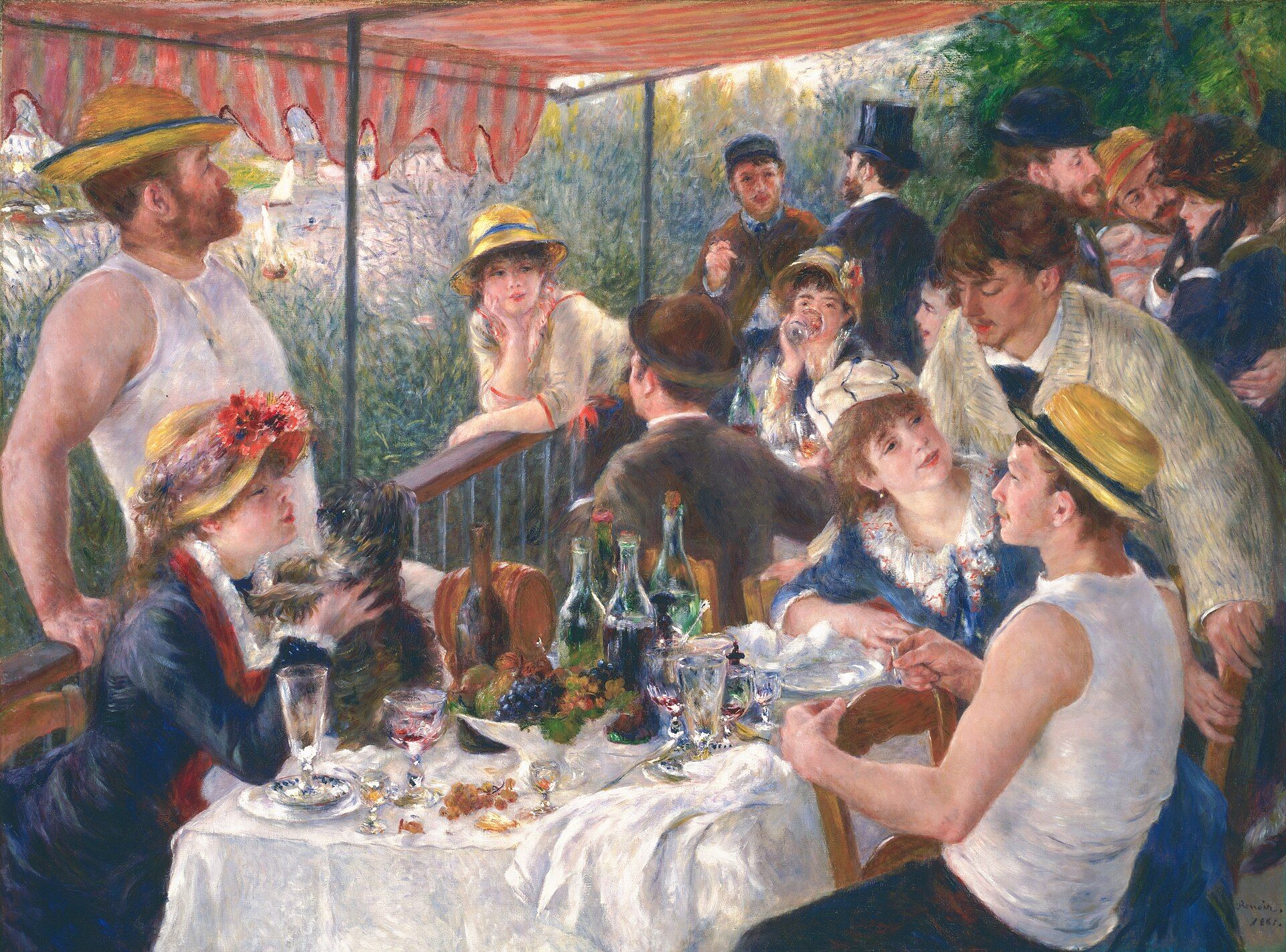 A party at a table on a shaded balcony above a river, straw hats and rowing vests among them, bottles and fruit left on a white cloth