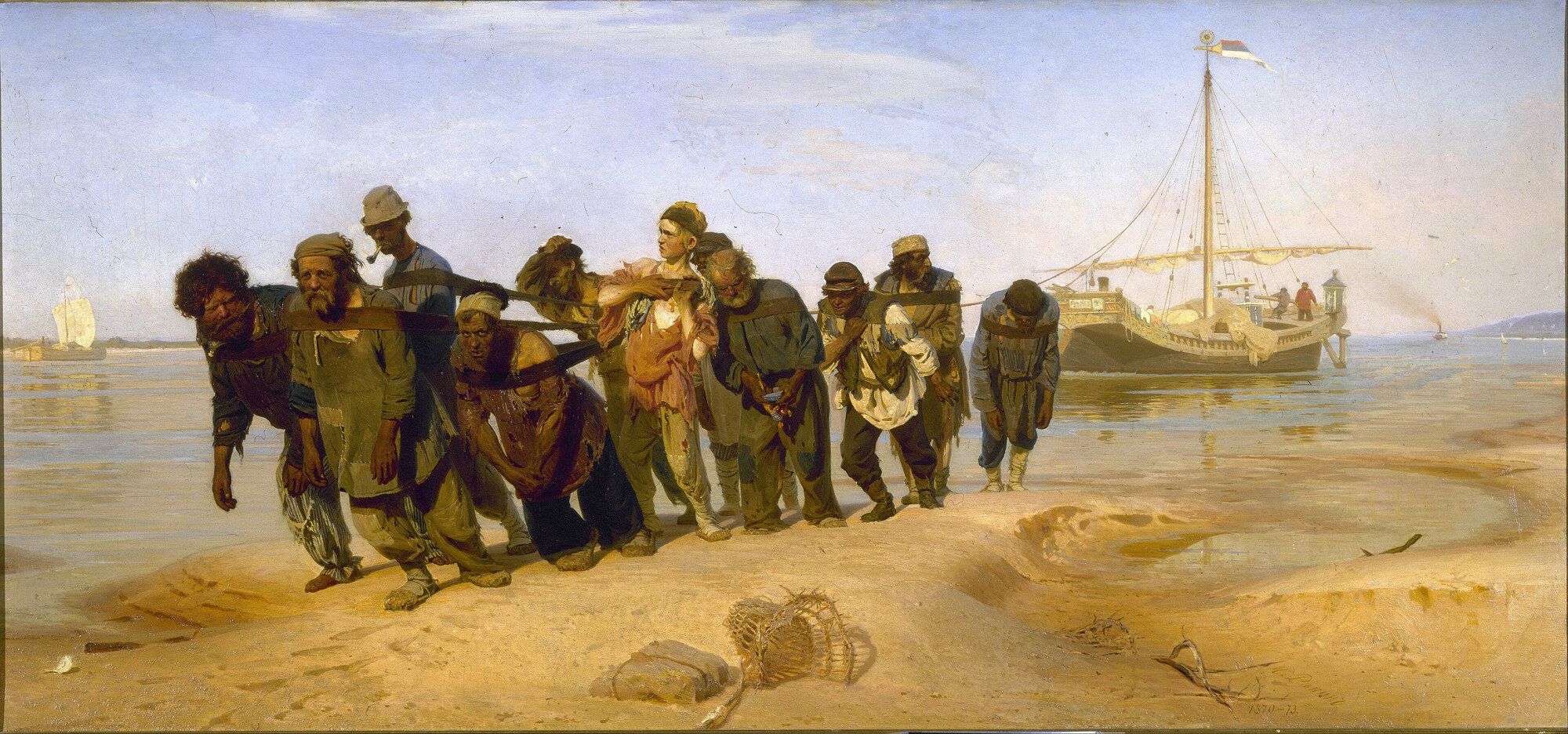 Eleven men in harness dragging a barge along a pale sand bank under a wide flat sky
