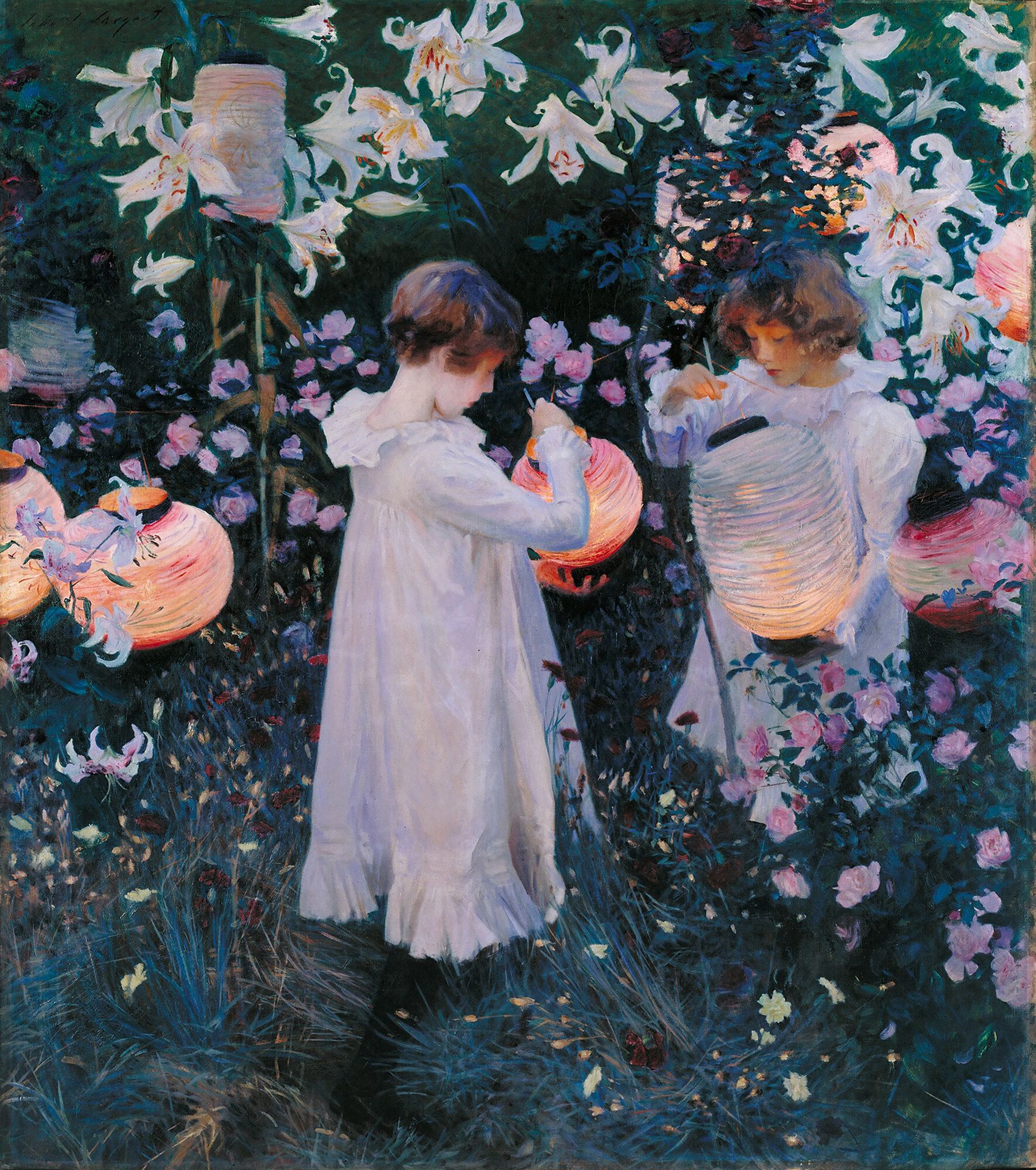Two girls in white lighting paper lanterns at dusk in a garden of tall lilies, roses and carnations