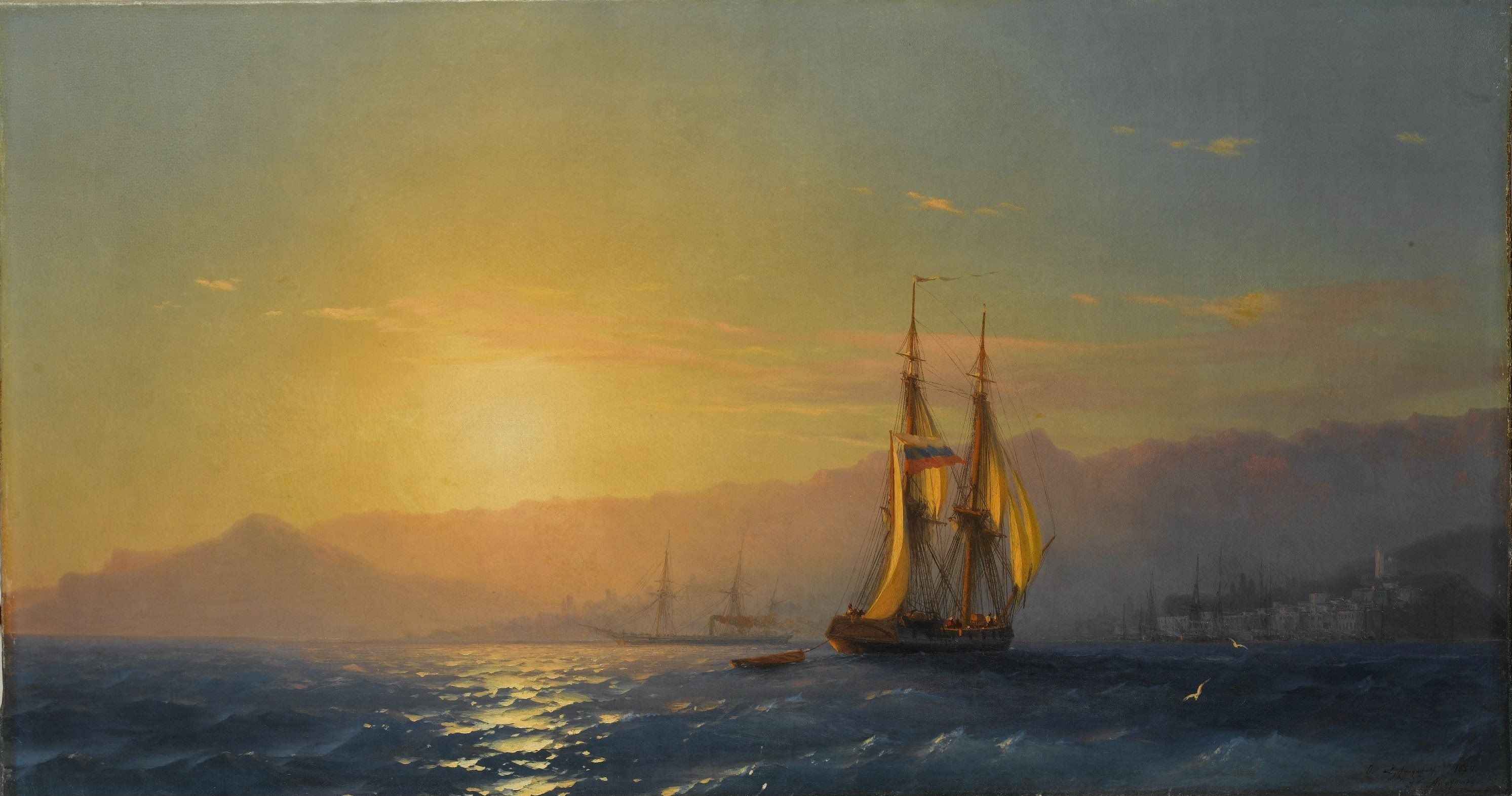 A golden sun sinks behind headlands as a ship with amber sails rides a glittering bay beside a coastal town