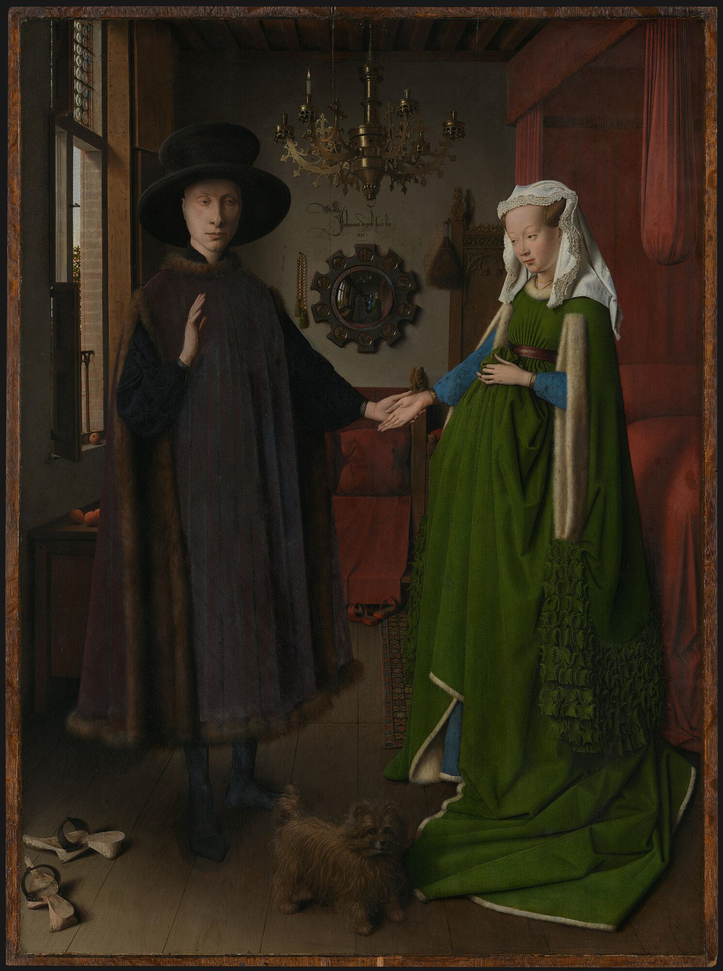 A man in a black hat and a woman in a green gown joining hands in a panelled room, a convex mirror and a small dog between them