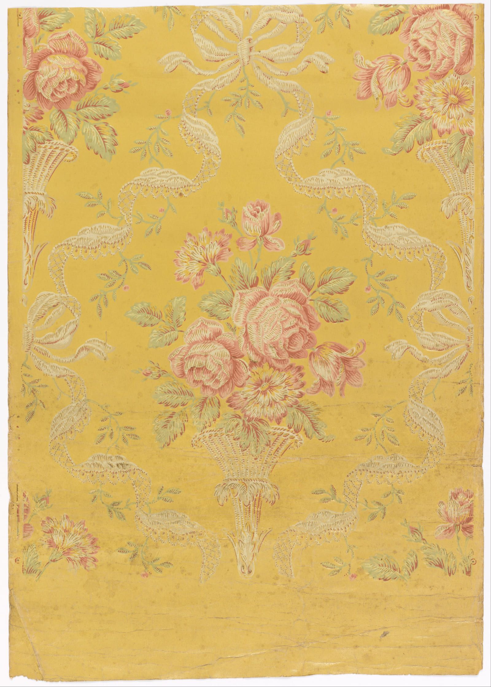 Roses and scattered blossom worked over a strong yellow ground in a repeating brocade pattern